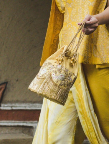 Deep Yellow Potli Handbag Handcrafted in Leather & Embellished with Tassels